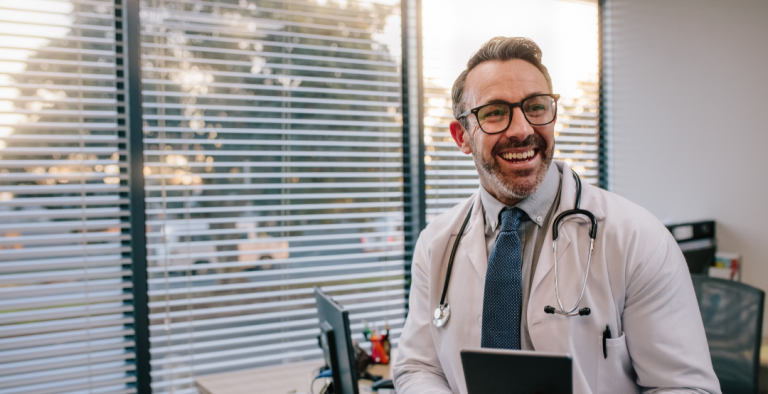 Doctor with Digital Tablet in His Office